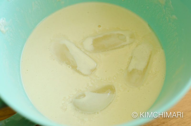 finished batter with ice cubes in the bowl