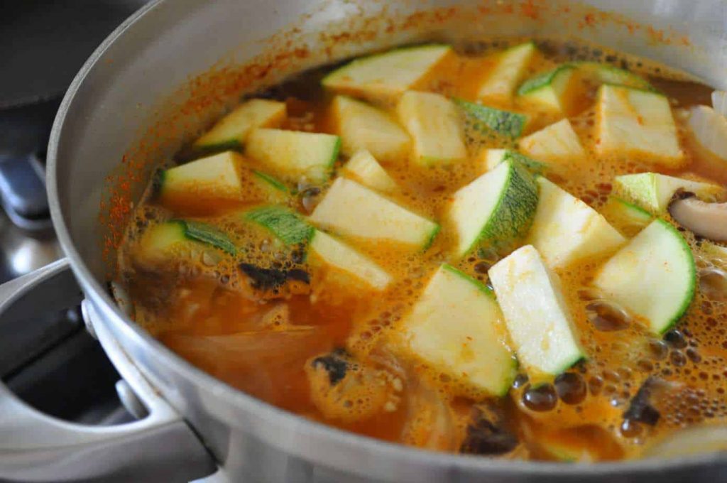 boiling stew in pot with vegetables