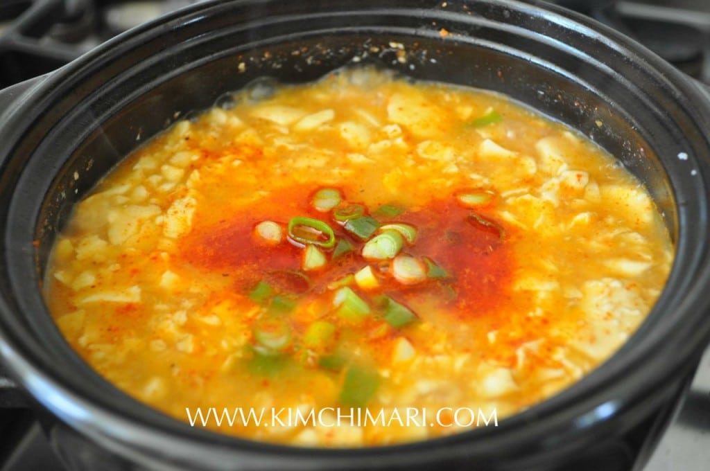 Sundubu Jjigae (Spicy Soft Tofu Stew) Boiling in Hot Pot