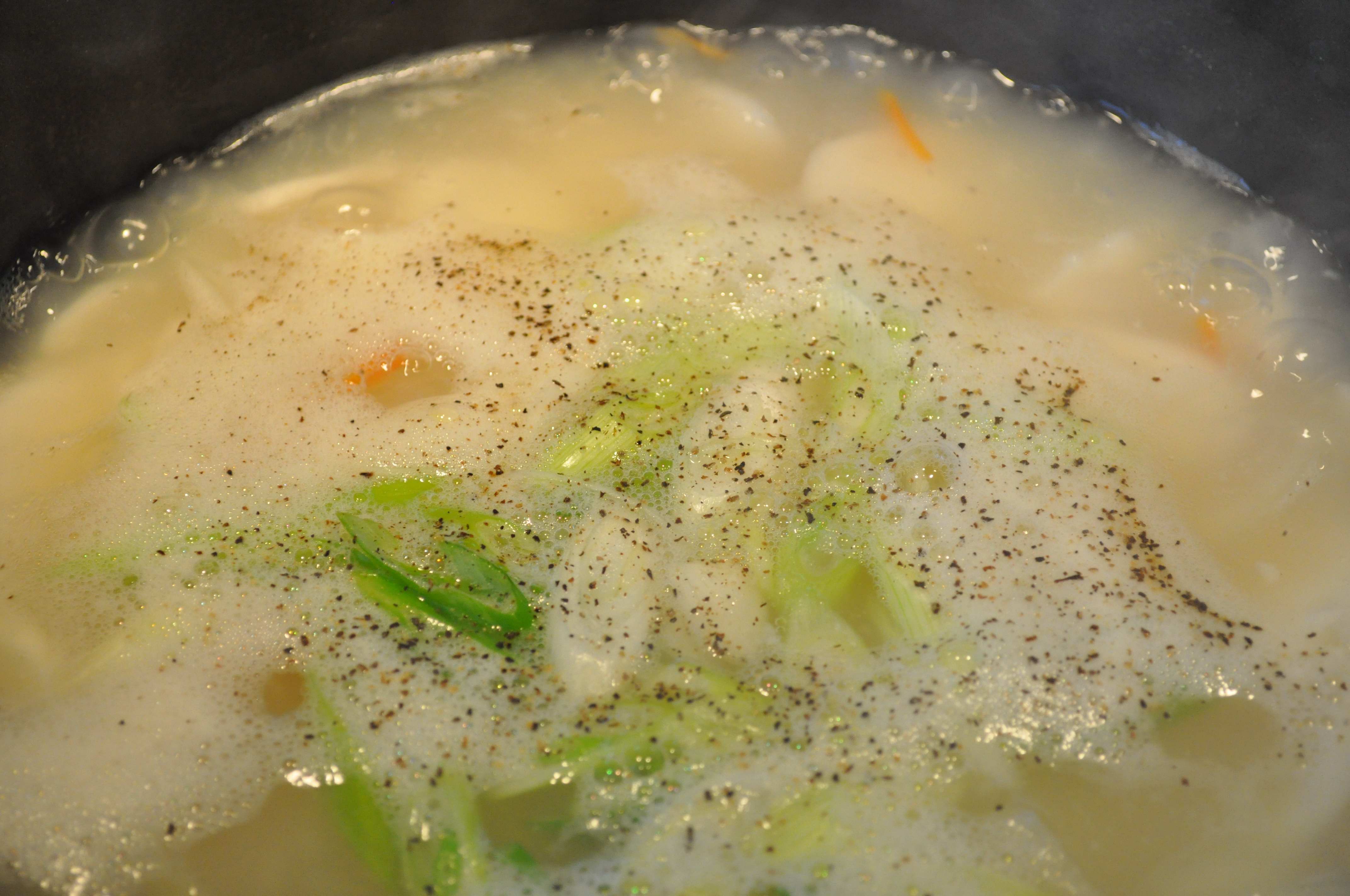 rice cake soup boiling in pot