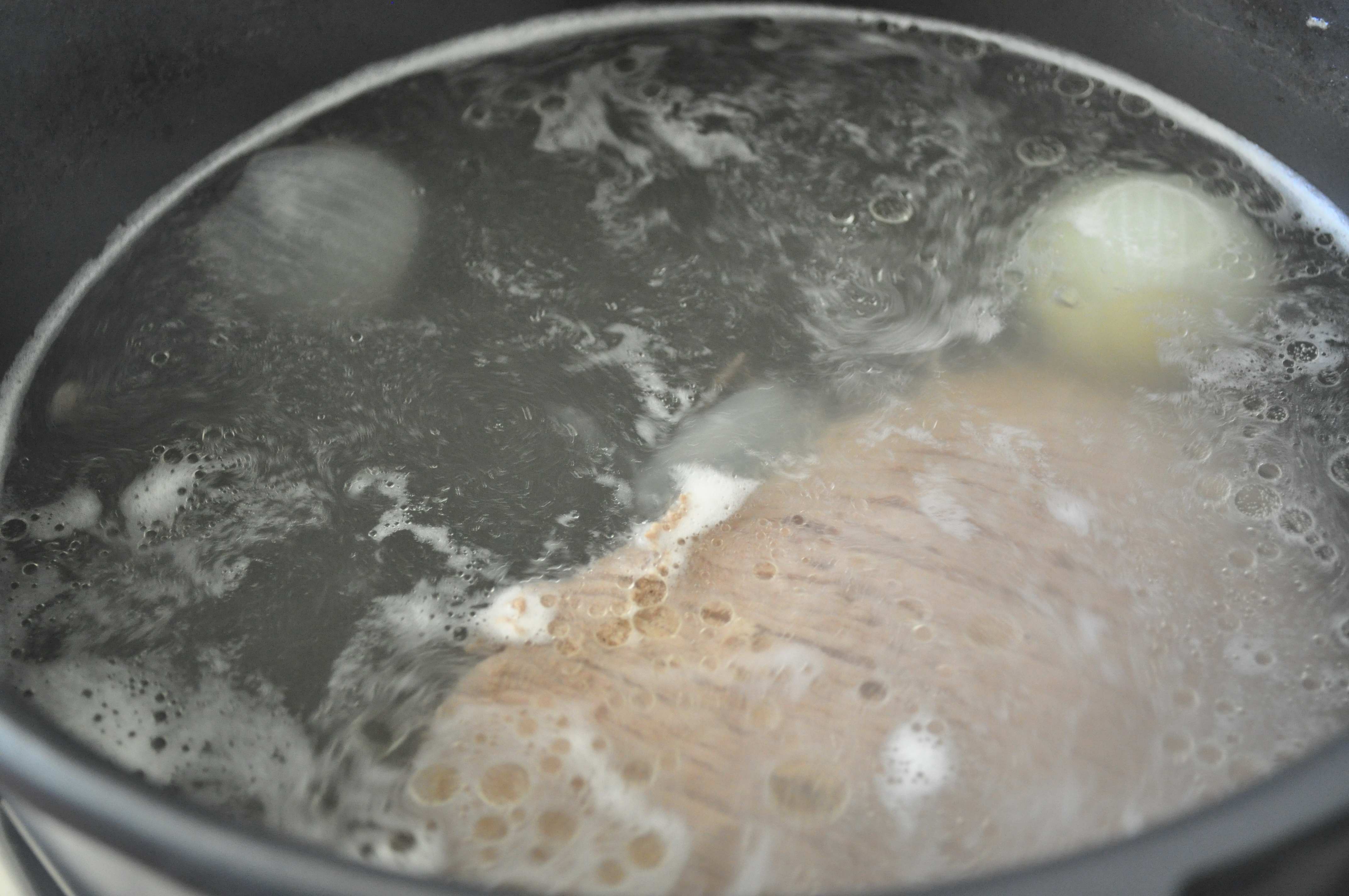 beef brisket boiling in water