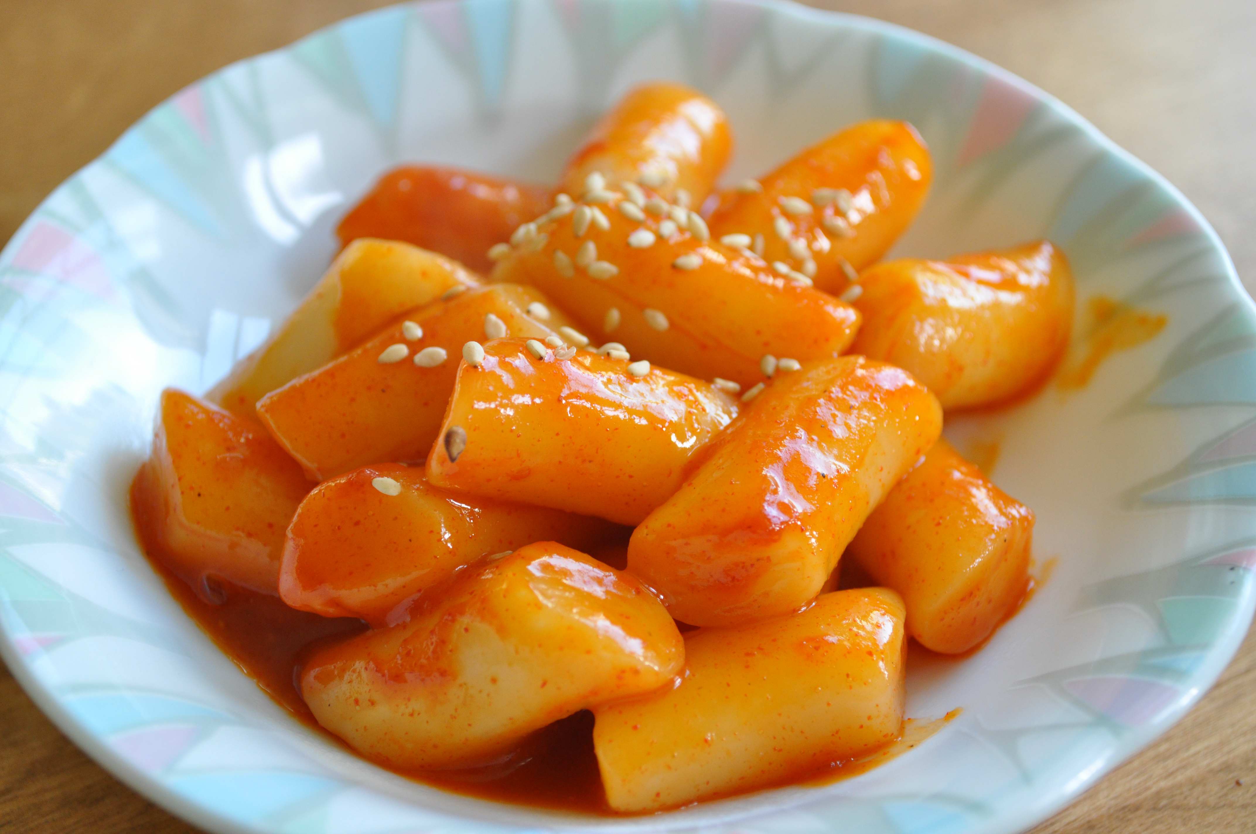 Tteokbokki or topokki, Korean street food, spicy rice cakes in red pepper  gochujang sauce, shot from the top with a place for text Stock Photo - Alamy