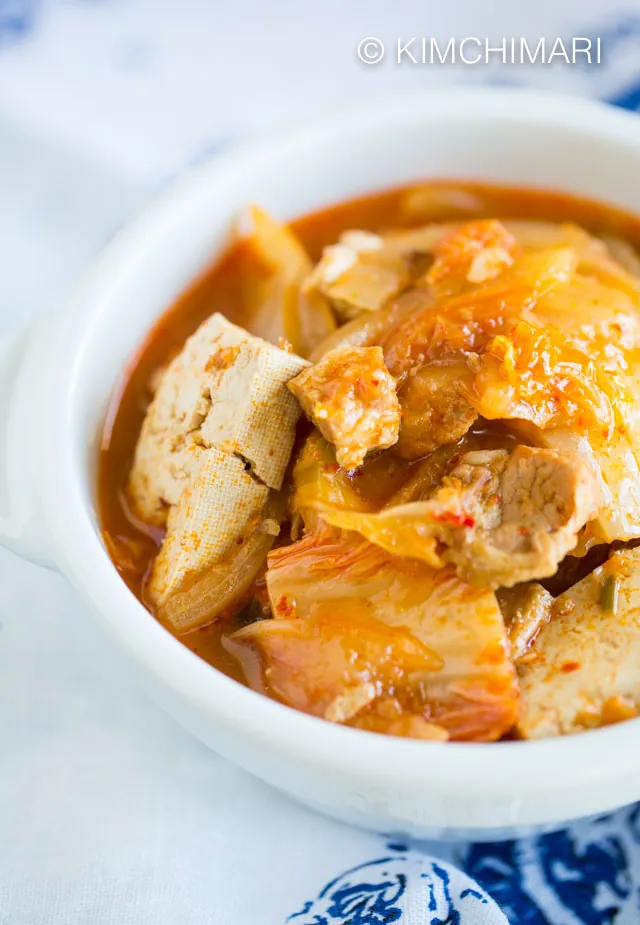 Kimchi Jjigae (Kimchi Stew with Pork Belly) in white bowl