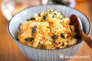 kimchi mari rice in bowl with wooden spoon