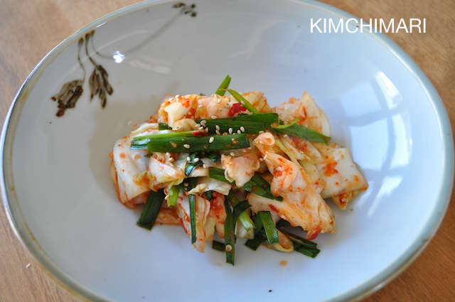Finished green cabbage kimchi in bowl