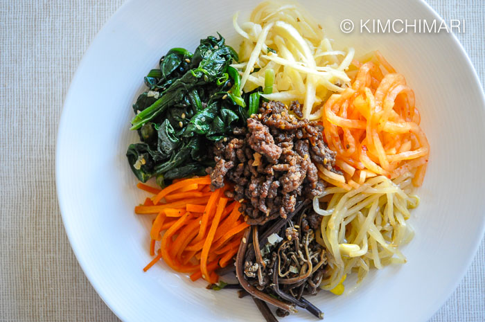 Bibimbap assembled with all topping in bowl but no egg