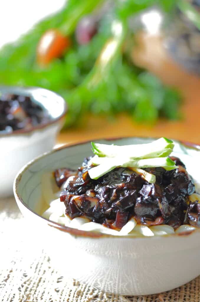 jajangmyeon black bean sauce noodles in bowl topped with cucumbers
