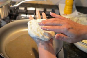 spreading dough for hotteok