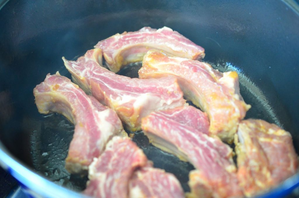 Pork ribs browning in pan