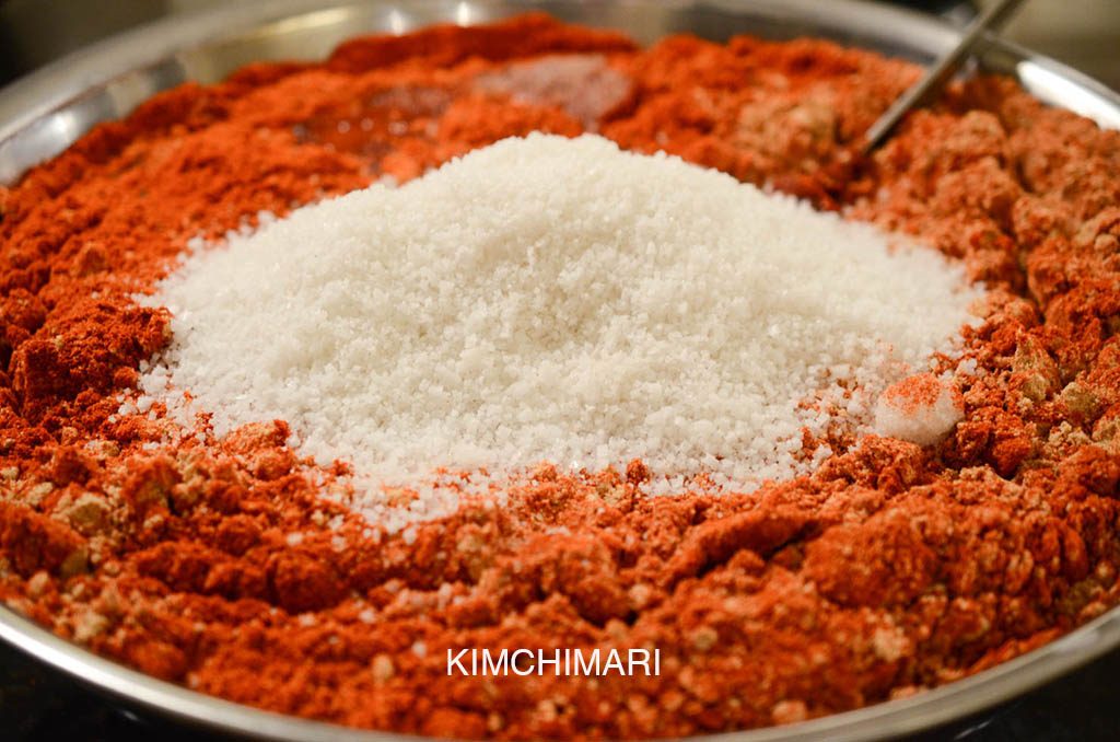 Korean gochujang in the making - gochukaru, mejukaru and sea salt added to fermented malt barley liquid