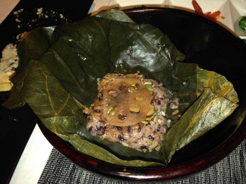 Multigrain rice in lotus leaf topped with lotus root