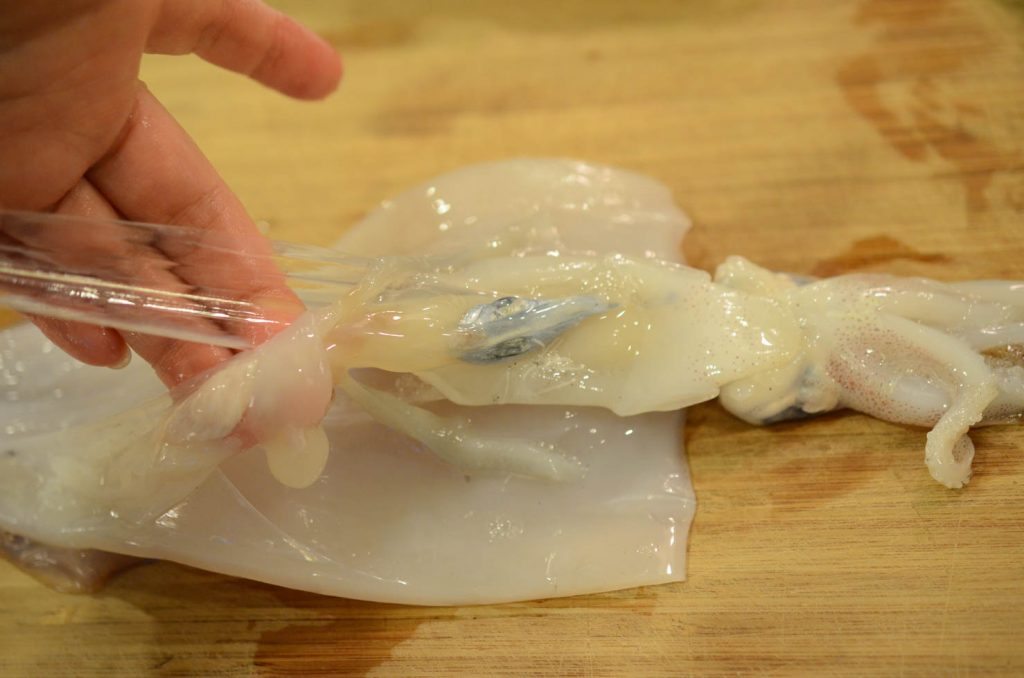 removing squid innards and bone