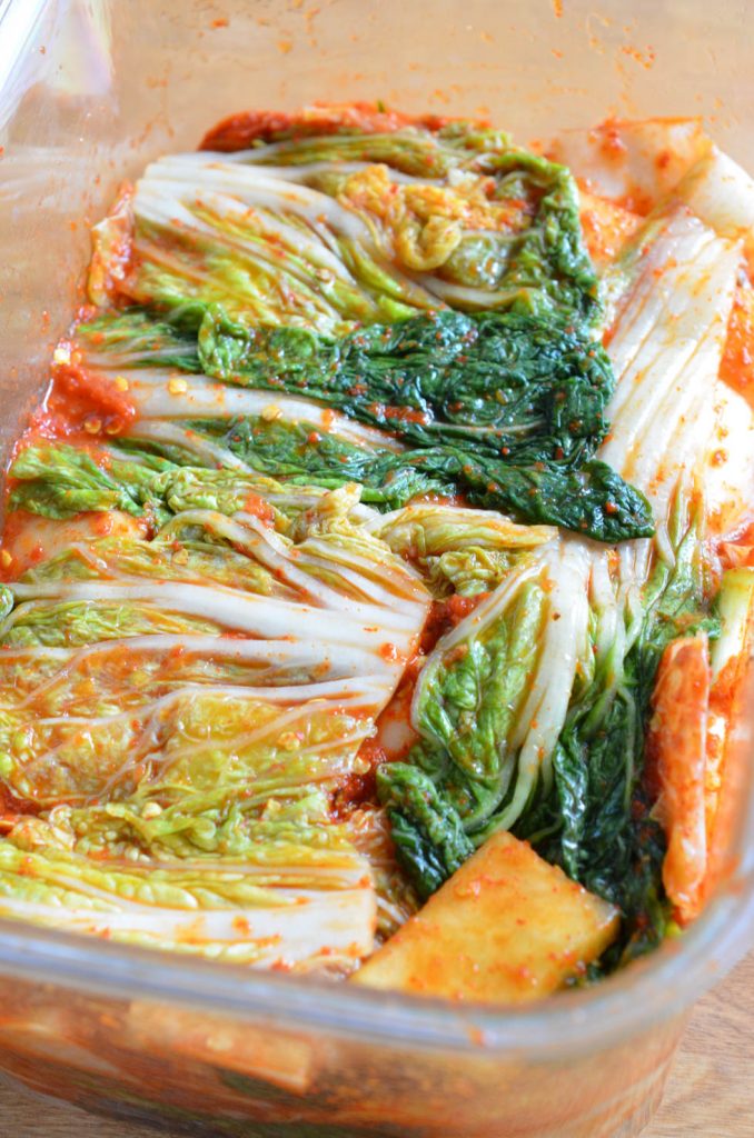 Mak Kimchi top covered with leaves