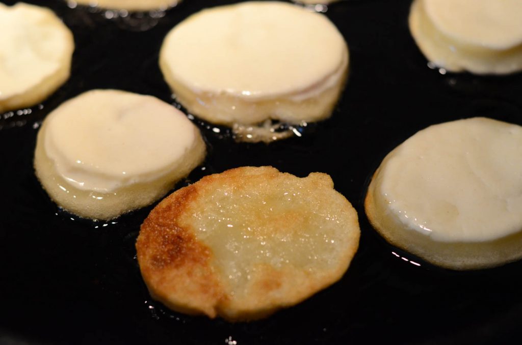 potato fritters or gamjajeon frying in pan