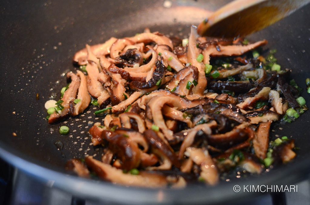 Stir-frying mushrooms for Japchae