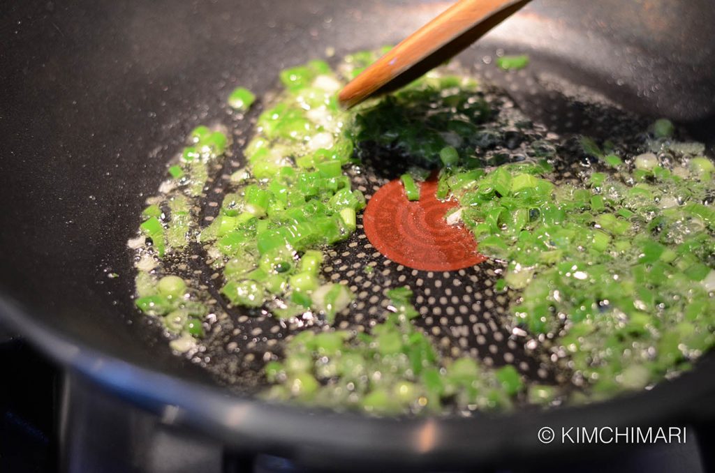 stir-frying green onion in oil for Japchae