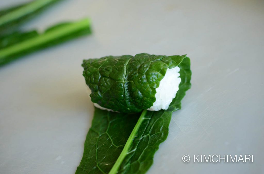 Rolling rice ball in kale for kale ssambap