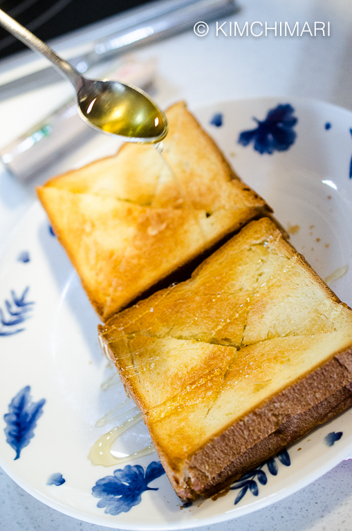 Finishing Injeolmi Toast with Honey Drizzle