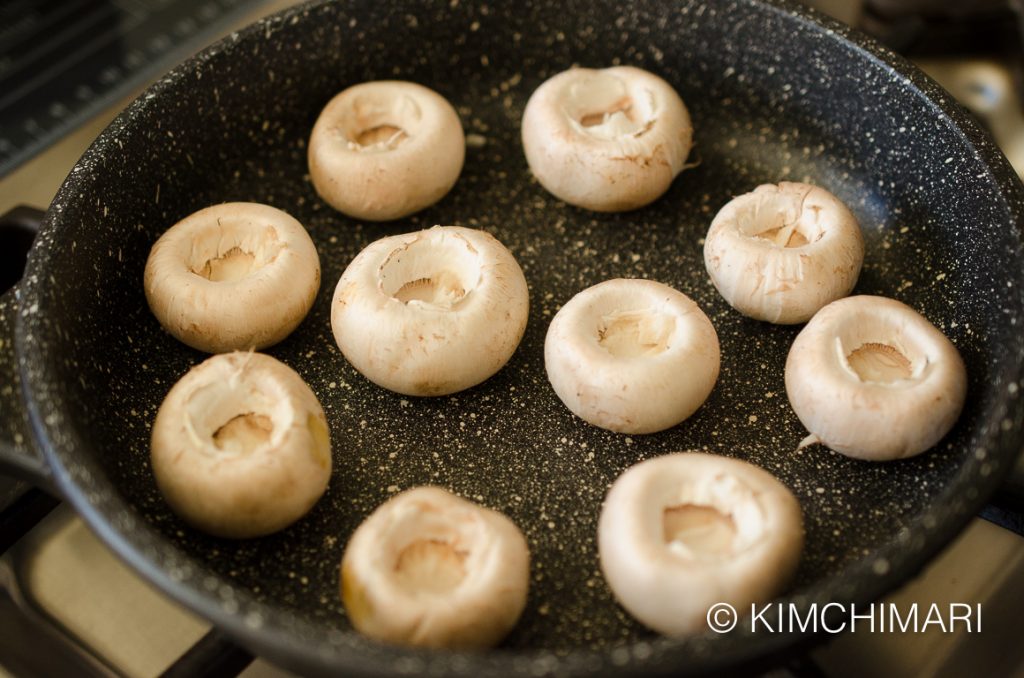 Mushroom Caps cooking in Pan