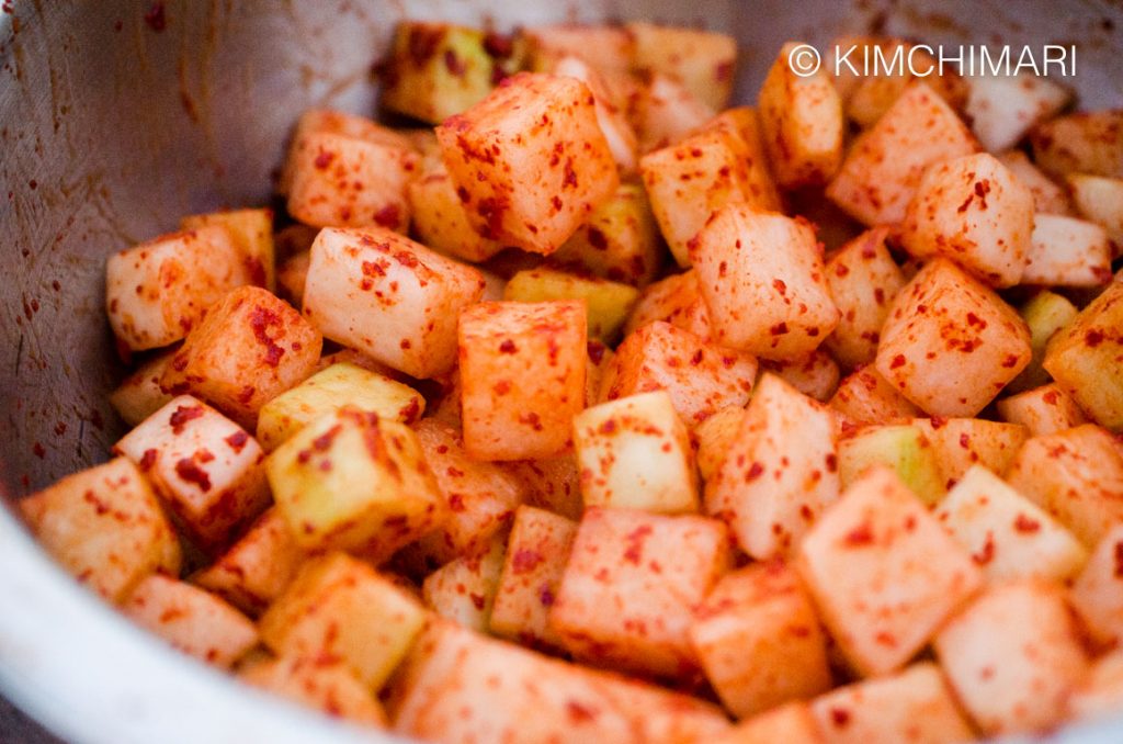 radish cubes after mixing and evenly coated with chili powder
