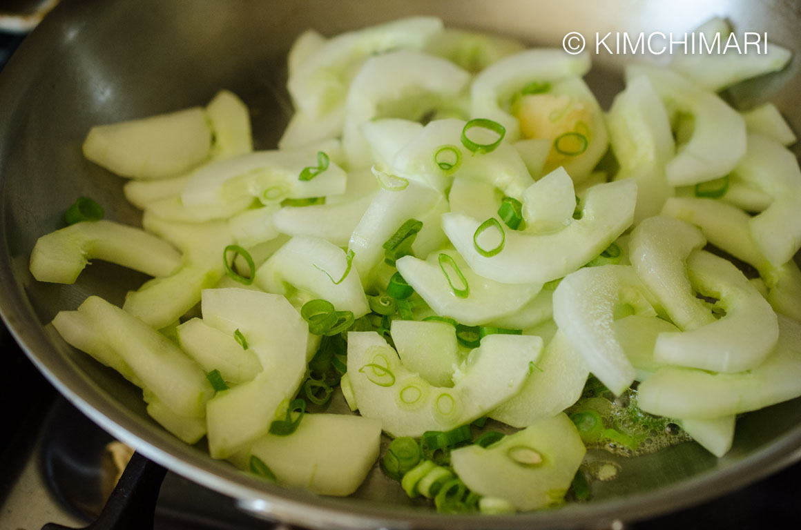 Cooking Cucumber in pan for Korean Nogak Namul with over ripe cucumbers