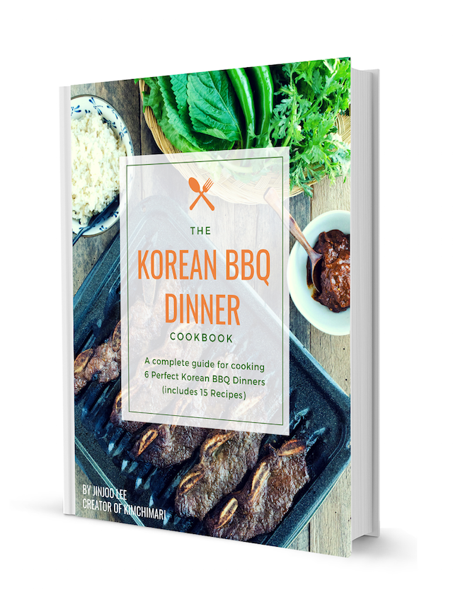 Korean BBQ Cookbook cover with Kalbi bbq spread in the background