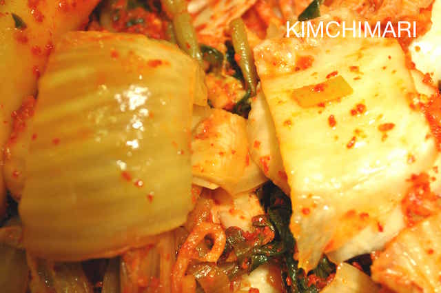side by side pic of sour kimchi and fresh kimchi