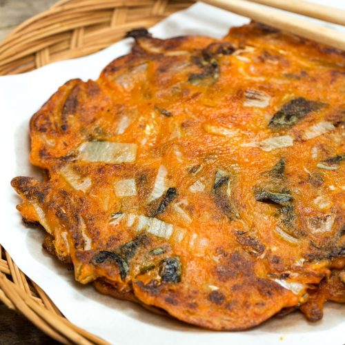 kimchi pancake on korean weaved plate