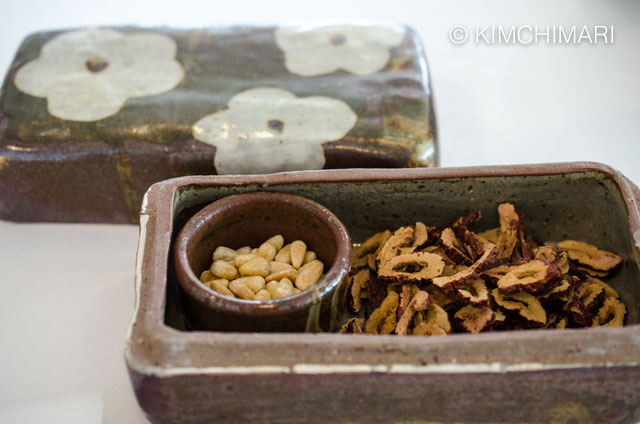 Ceramic box filled with dried jujubes and pine nuts
