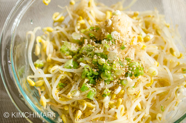 Green onions, garlic and seasoning added on top of Cooked Soybean Sprouts