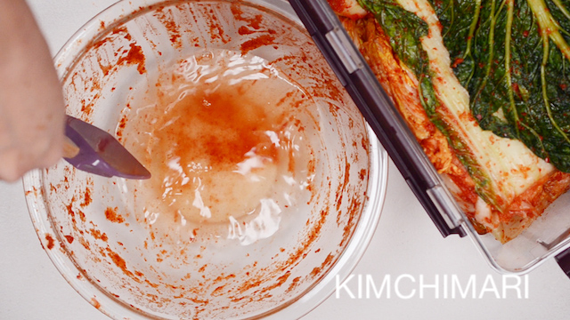 Rinsing the seasoning bowl with water to make liquid for Kimchi
