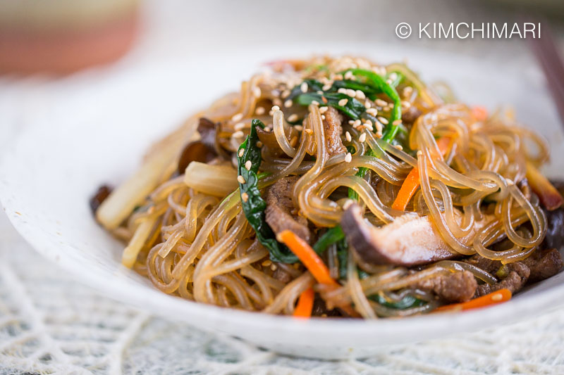 https://kimchimari.com/wp-content/uploads/2019/02/Japchae-Korean-Glass-Noodles-Closeup-1.jpg