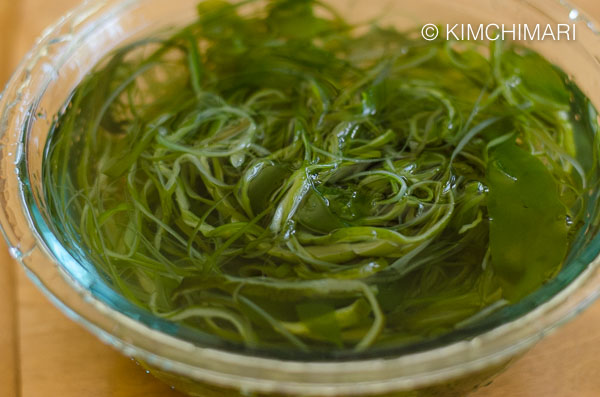 seaweed stem soaking in a glass bowl of water