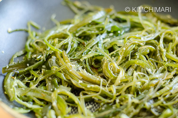 sauteed seaweed with garlic in frying pan