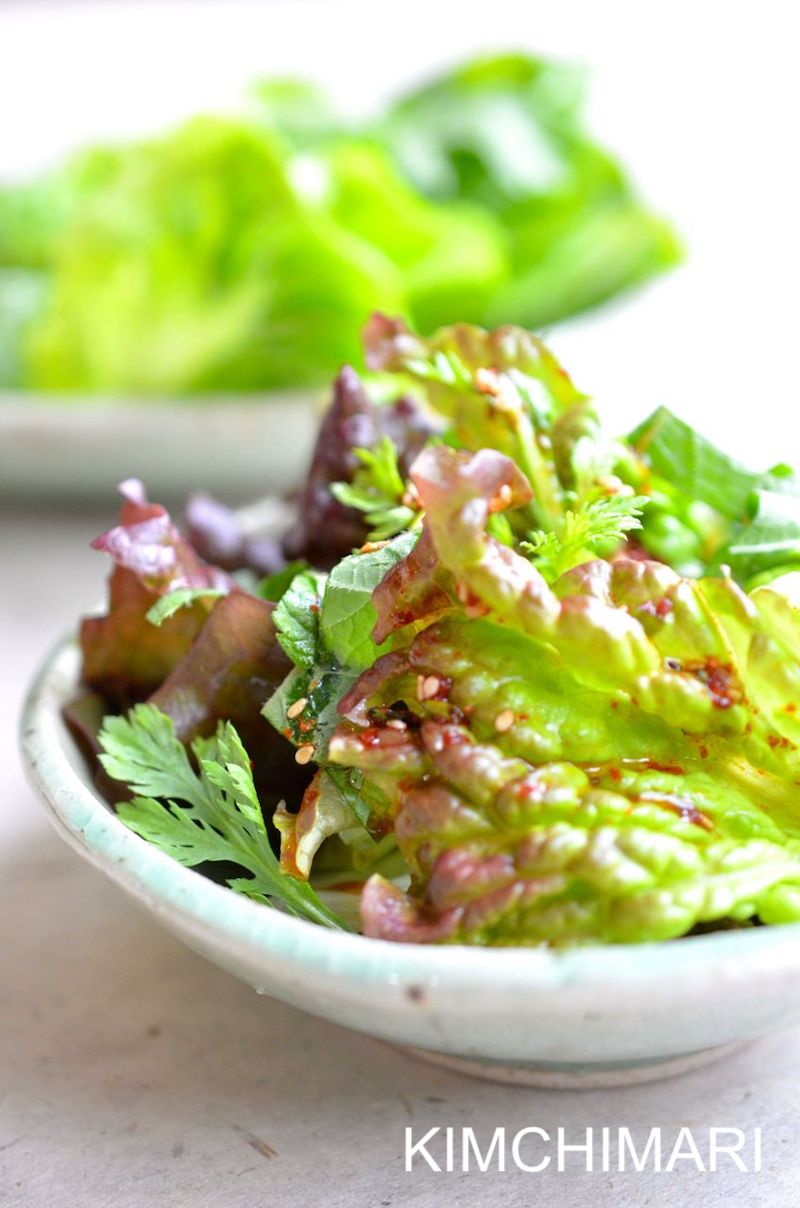 lettuce salad plated on light blue plate