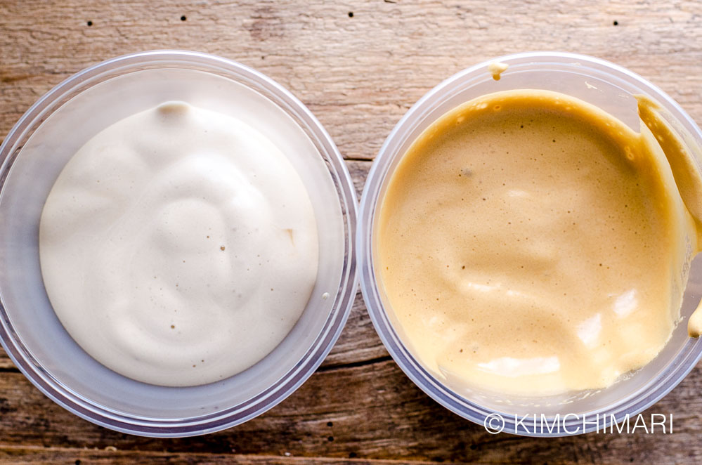 two containers of coffee foam, a creamy colored and a milk coffee colored