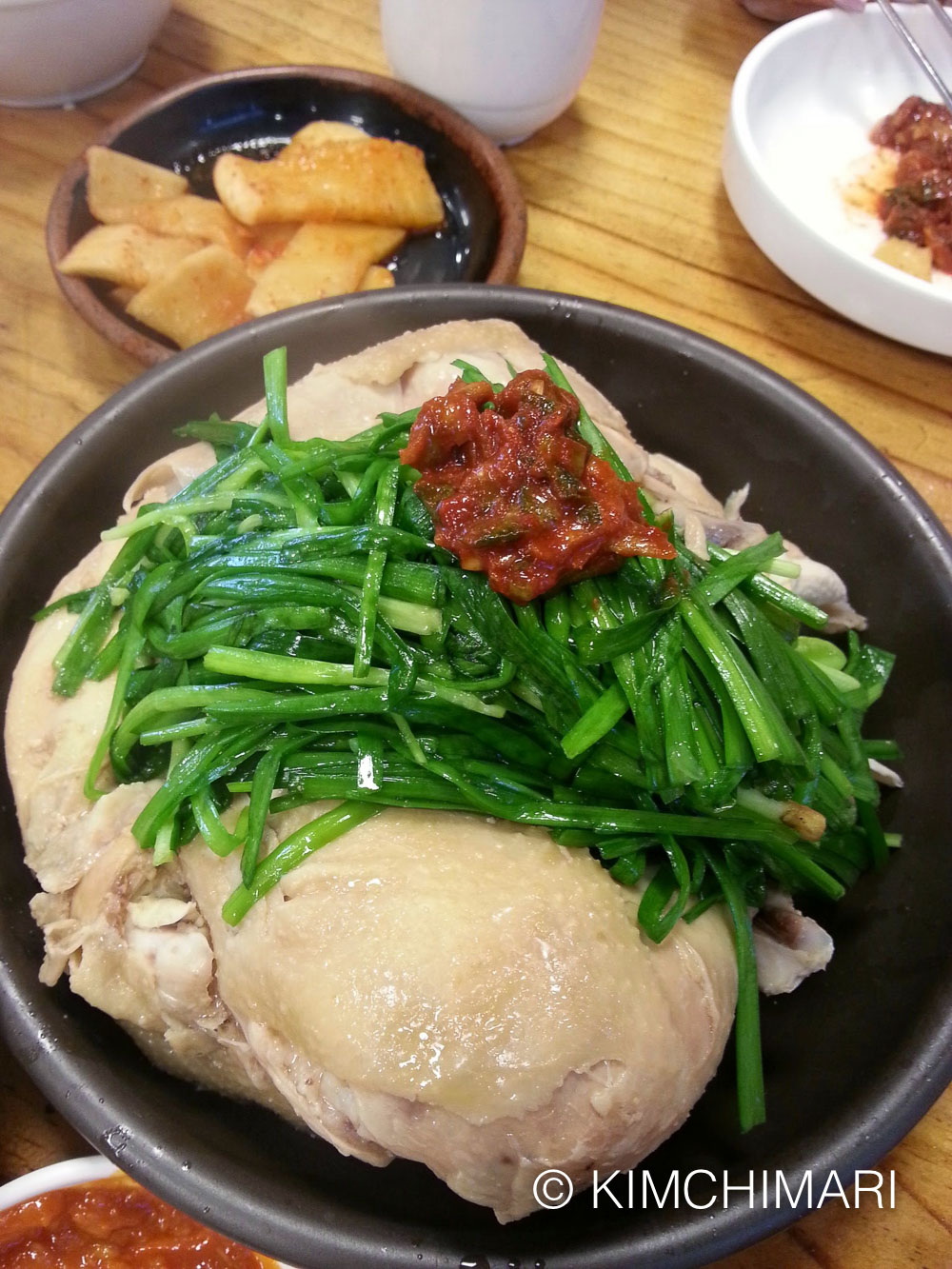 jjimdak served with chives and sauce at Jinnampo restaurant in Seoul