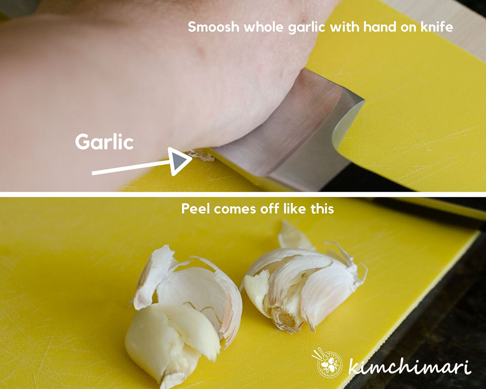 smooshing garlic with the side of knife to peel