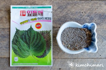 perilla seed packet and a small bowl filled with perilla seeds