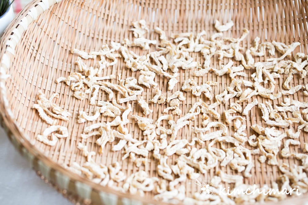 Dried radish strips laid out on Korean weaved basket