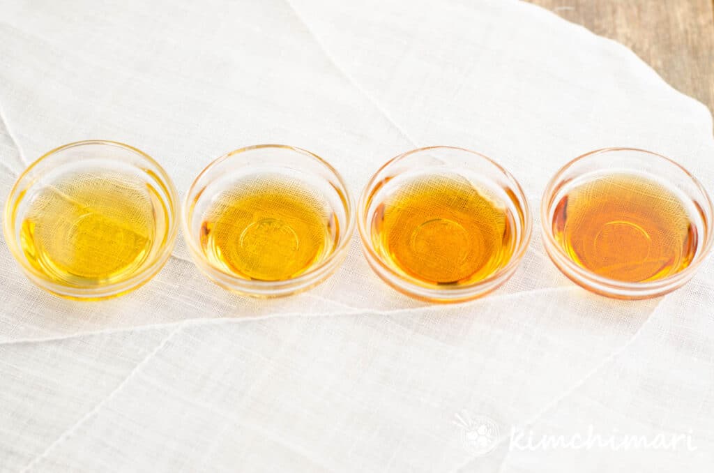 4 different color sesame oil in small glass bowls from light to dark