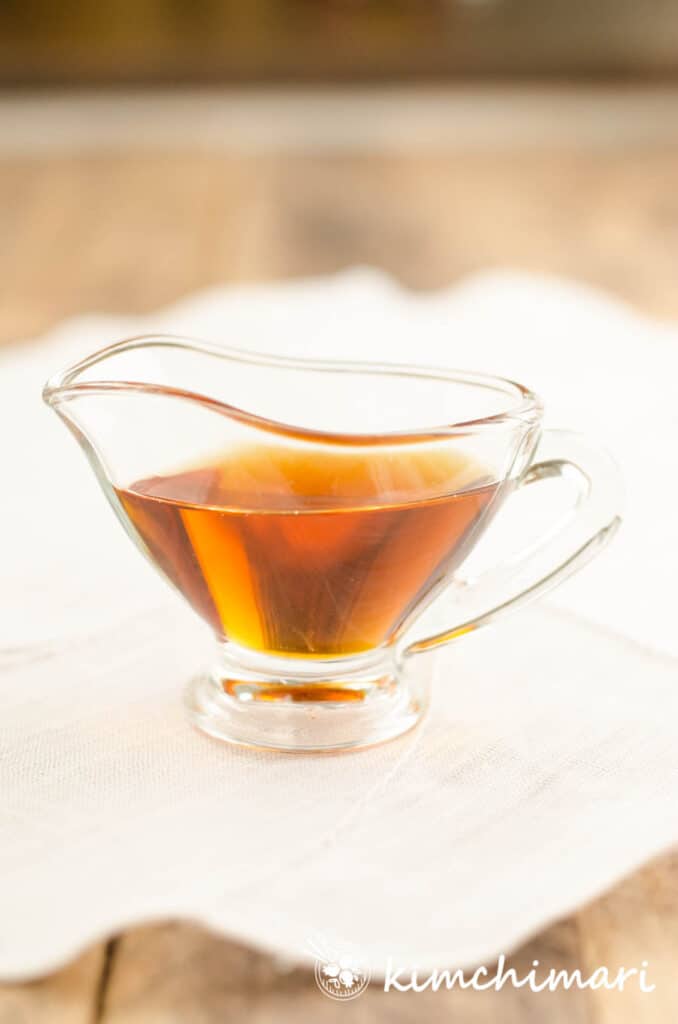 sesame oil in glass gravy boat