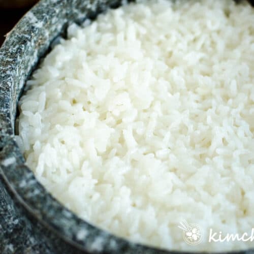 cooked rice in stone pot close up