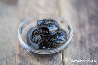 black bean paste in glass dish close up