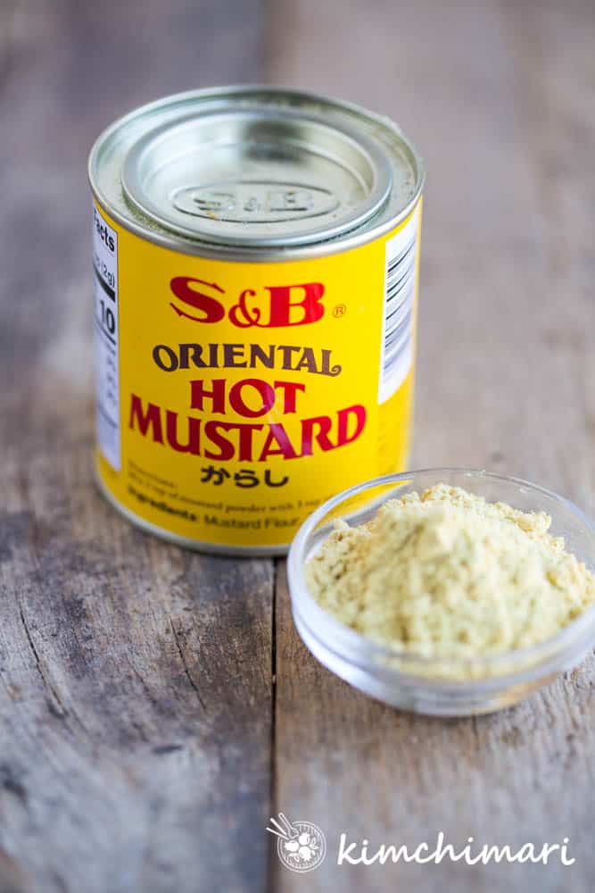 can of S&B oriental hot mustard and powder in a bowl next to the can