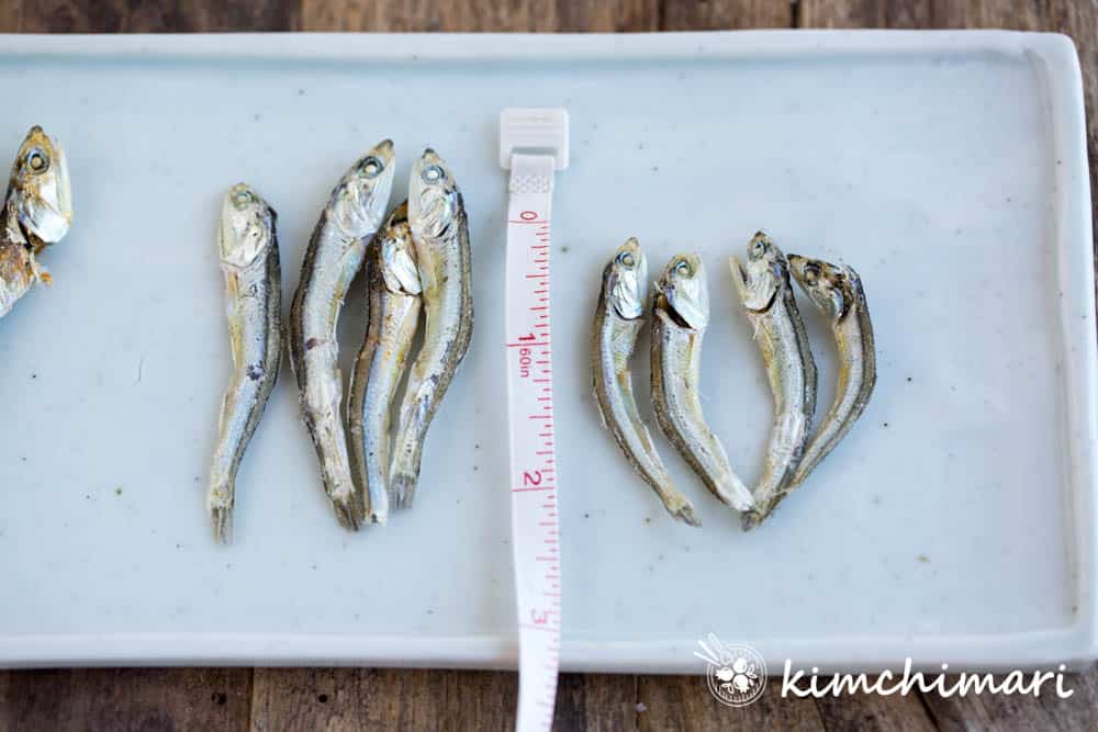 2 inch or shorter dried anchovies with a ruler next to the fish