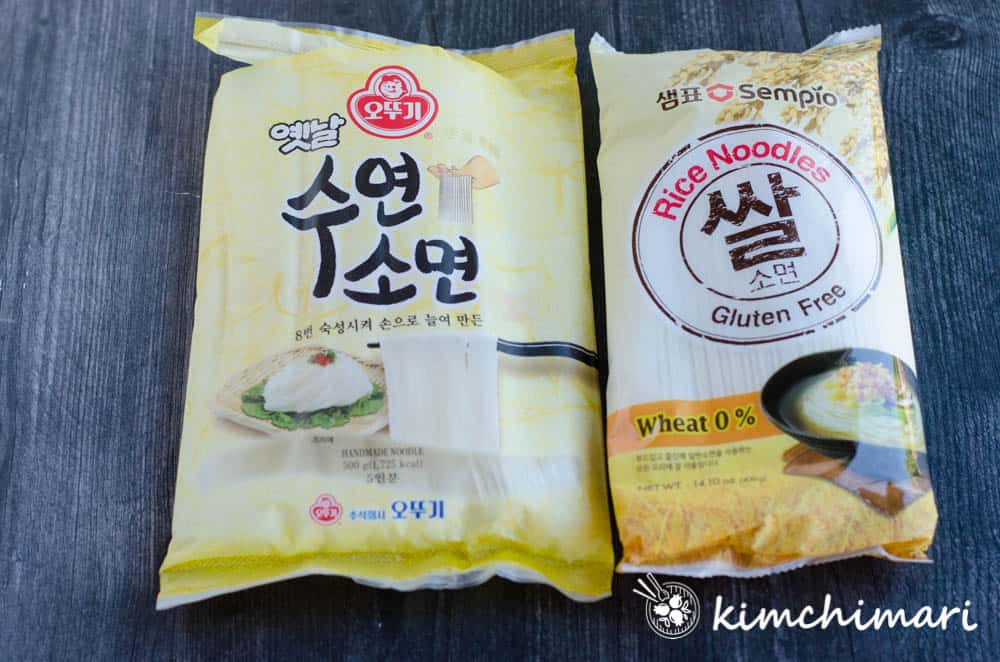 side by side packages of ottogi wheat somyeon and sempio gluten free rice somyeon