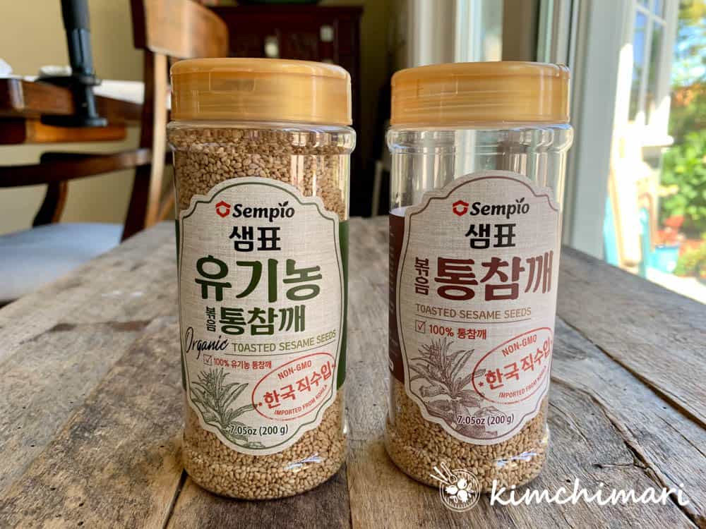 korean sesame seeds bottles by sempio - left is organic and right is regular