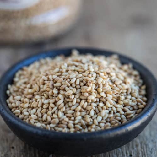 roasted sesame seeds in small black bowl