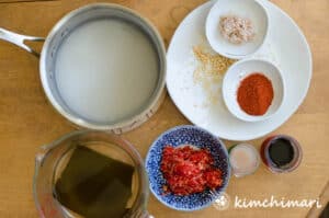 top view of different kimchi seasoning ingredients in bowls
